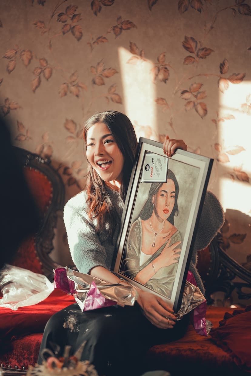 Samragyee RL Shah holding portrait